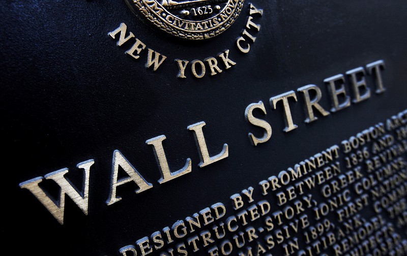 
              FILE - This Jan. 4, 2010, file photo shows an historic marker on Wall Street in New York. On Thursday, April 27, 2017, global stocks were subdued as investors assessed the scant details of President Donald Trump's U.S. tax overhaul. (AP Photo/Mark Lennihan, File)
            