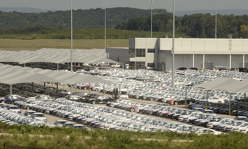 New cars await shipment Thursday, Aug. 21, 2014, at the Chattanooga Volkswagen plant in Chattanooga, Tenn. 