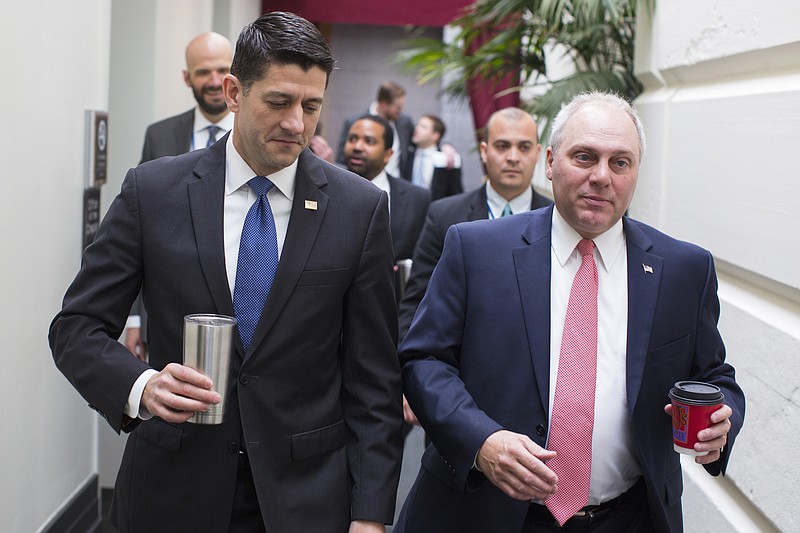 
              House Speaker Paul Ryan of Wis., left, talks with House Majority Whip Steve Scalise of La. as they arrive for a GOP caucus meeting on Capitol Hill in Washington, Wednesday, April 26, 2017. (AP Photo/Evan Vucci)
            