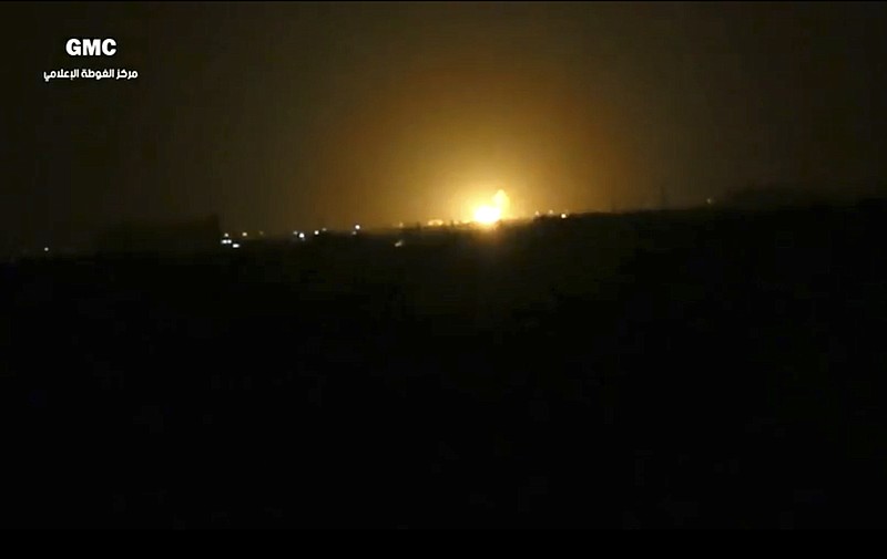 
              This frame grab from video provided by the Syrian anti-government activist group Ghouta Media Center, which has been authenticated based on its contents and other AP reporting, shows flames rising after an explosion near an airport west of Damascus, Syria, Thursday, April 27, 2017. Syria's state media reported Thursday that Israel has attacked a military installation near the Damascus International Airport. SANA says Israel fired several missiles from inside the occupied Golan Heights south of the capital at a military installation near the capital's main airport, triggering several explosions and causing damage. (Ghouta Media Center via AP)
            