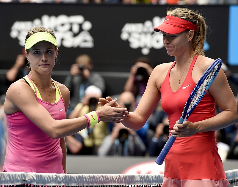 
              FILE - In this Jan. 27, 2015, file photo, Maria Sharapova, of Russia right, is congratulated by Eugenie Bouchard, of Canada, after winning their quarterfinal match at the Australian Open tennis championship in Melbourne, Australia. If Bouchard had her way, Sharapova would have been banned from tennis for life. The 2014 Wimbledon finalist from Canada, who has been ranked as high as fifth in the world, called Sharapova a cheater upon the Russian's return from a 15-month doping suspension for using the banned substance meldonium. (AP Photo/Andy Brownbill, File)
            