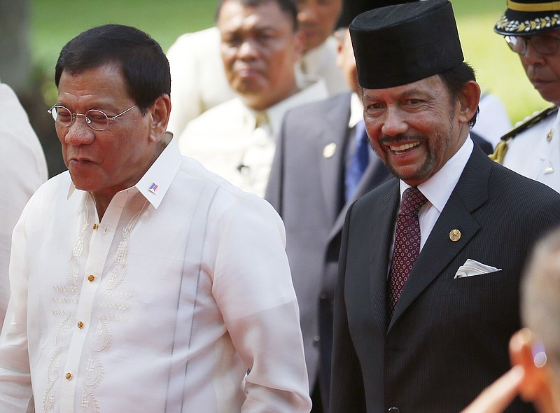 
              Sultan Hassanal Bolkiah, right, of Brunei and Philippine President Rodrigo Duterte, chat as they walk for their bilateral meeting following welcoming ceremony for the Sultan Thursday, April 27, 2017 at Malacanang Palace in Manila, Philippines. Bolkiah arrived Wednesday for a state visit and to attend the annual ASEAN Leaders' Summit which the Philippines is hosting this weekend.(AP Photo/Bullit Marquez)
            