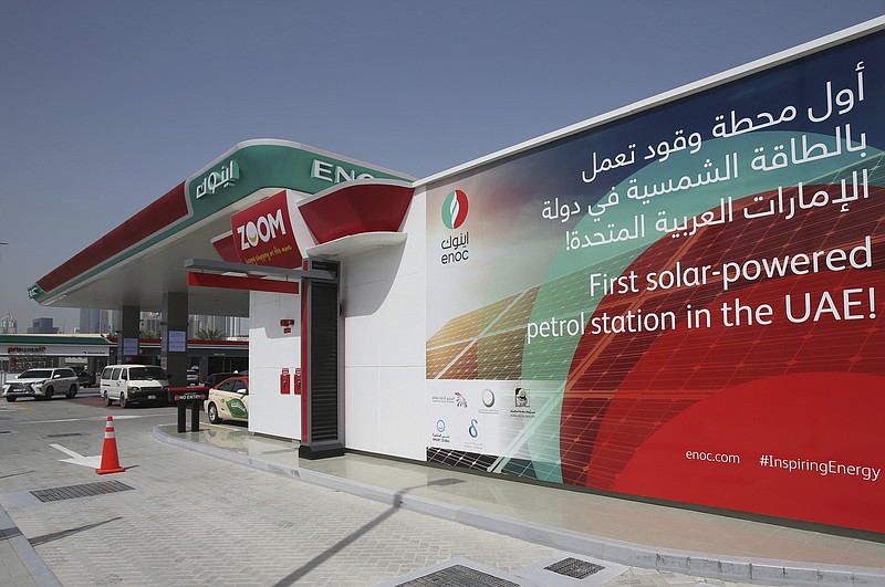 
              Solar panels power an Emirates National Oil Company gas station, in Dubai, United Arab Emirates, Thursday, April 27, 2017. The government-owned oil company said Wednesday the country's first solar-powered gas station in Dubai, on the city's main Sheikh Zayed Road thoroughfare, is covered with solar panels that can generate up to 120 kilowatt hours. (AP Photo/Kamran Jebreili)
            