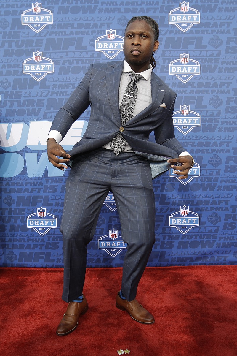 UCLA's Takkarist McKinley arrives for the first round of the 2017 NFL football draft, Thursday, April 27, 2017, in Philadelphia. (AP Photo/Julio Cortez)