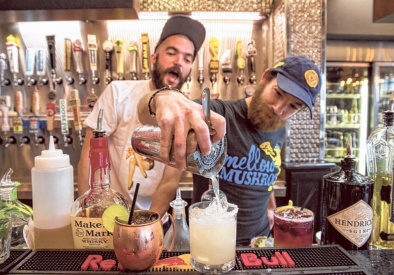 Brooks Northern and Justin Grasham mix a drink. (Photo by Mark Gilliland)