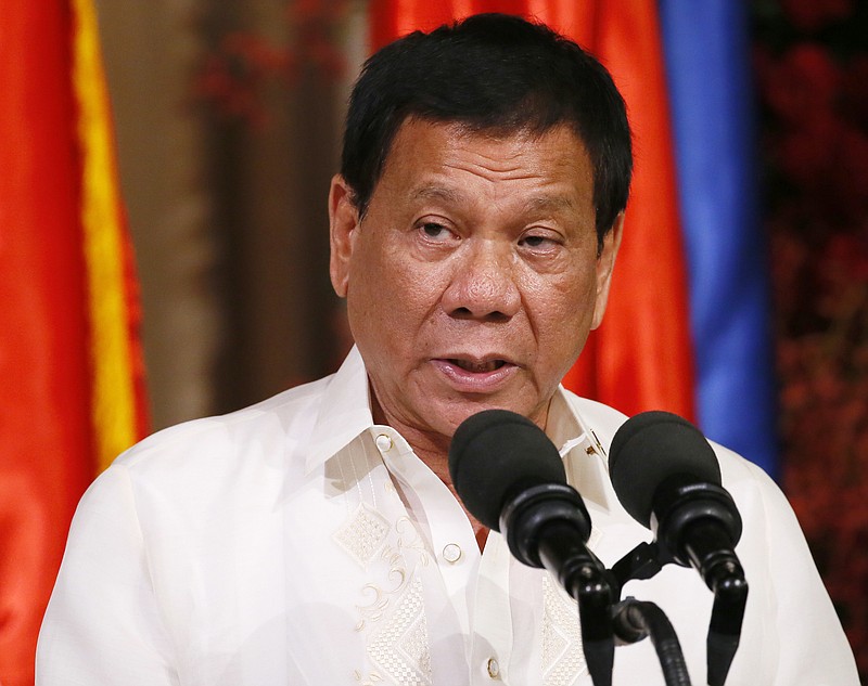 
              Philippine President Rodrigo Duterte addresses the media during his joint press statement with Indonesian President Joko "Jokowi" Widodo following their bilateral meeting at the Malacanang Palace in Manila, Philippines Friday, April 28, 2017. When Duterte hosts a summit of Southeast Asian leaders this weekend, the spotlight will be on him. Just less than a year in power, Duterte faces a mass murder complaint before the International Criminal Court and an impeachment bid at home as bodies continue to pile up in his war on illegal drugs. (AP Photo/Bullit Marquez)
            