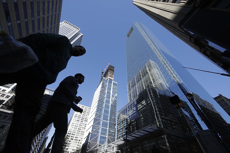 
              In this Wednesday, March 29, 2017, photo, people walk near the Comcast Innovation and Technology Center under construction, middle, and the Comcast Center, center right, in Philadelphia. On Friday, April 28, 2017, the Commerce Department issues the first of three estimates of how the U.S. economy performed in the January-March quarter. (AP Photo/Matt Rourke)
            