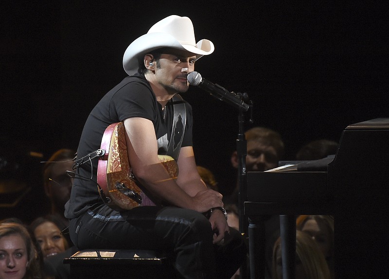 
              FILE - In this Nov. 2, 2016 file photo, Brad Paisley performs at the 50th annual CMA Awards in Nashville, Tenn. Paisley's newest album, "Love and War," was released this month. (Photo by Charles Sykes/Invision/AP, File)
            