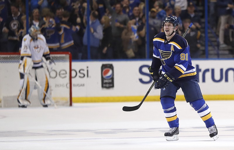 
              St. Louis Blues right wing Vladimir Tarasenko (91), of Russia, skates in front of Nashville Predators goalie Pekka Rinne, of Finland, left, after Tarasenko scored the winning goal during the third period in Game 2 of an NHL hockey second-round playoff series Friday, April 28, 2017, in St. Louis. The Blues won 3-2 to even the series 1-1. (AP Photo/Jeff Roberson)
            