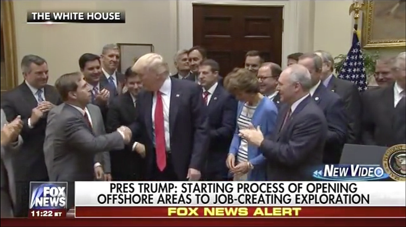 Chuck Fleischmann shakes hands with Donald Trump in this screenshot from a video. 