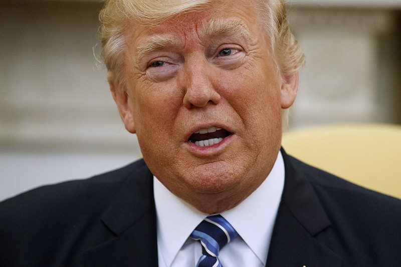 President Donald Trump speaks in the Oval Office of the White House in Washington. (AP Photo/Evan Vucci)