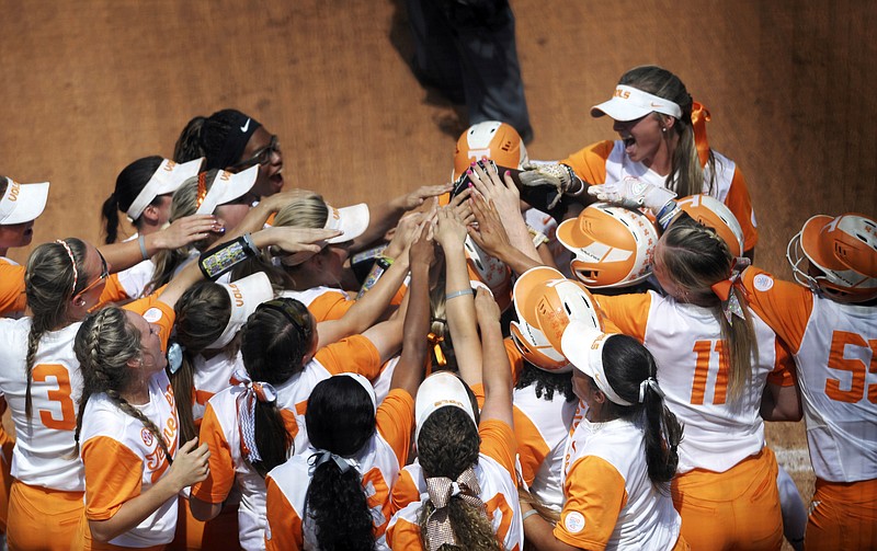 The Tennessee softball team celebrates a grand slam by Megan Geer in Sunday's game against Florida in Knoxville. The Gators, who already had two wins in the bank at the start of Sunday's game, had the potential to sweep Tennessee. However, Geer's slam gave the Lady Vols their first runs of the weekend on the way to a 5-1 victory. Tennessee will close out its regular season with a series at No. 5-ranked Texas A&M next weekend.