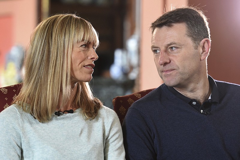 
              Kate and Gerry McCann, whose daughter Madeleine disappeared from a holiday flat in Portugal ten-years ago, react during a BBC TV interview in Loughborough, England, Friday April 28, 2017.  The parents of Madeleine McCann have vowed to do "whatever it takes for as long as it takes" to find her as they prepare to mark the tenth anniversary of her disappearance on the evening of 3 May 2007, from her bed in a holiday apartment in Praia da Luz resort in the Algarve, Portugal. (Joe Giddens/Pool via AP)
            