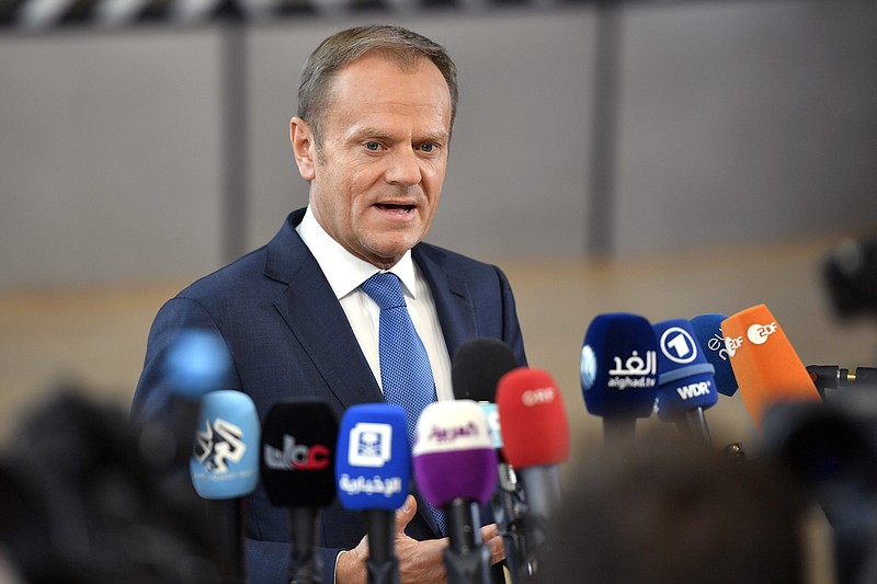 
              European Council President Donald Tusk speaks with the media as he arrives for an EU summit at the Europa building in Brussels on Saturday, April 29, 2017. EU Council President Donald Tusk says that Britain will face a united bloc of 27 EU nations in the two years of divorce negotiations and said the welfare of citizens and families living in each other's nations will be the priority once the talks start. (AP Photo/Martin Meissner)
            