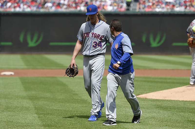 
              New York Mets starting pitcher Noah Syndergaard (34) leaves a baseball game with an injury during the second inning against the Washington Nationals, Sunday, April 30, 2017, in Washington. (AP Photo/Nick Wass)
            