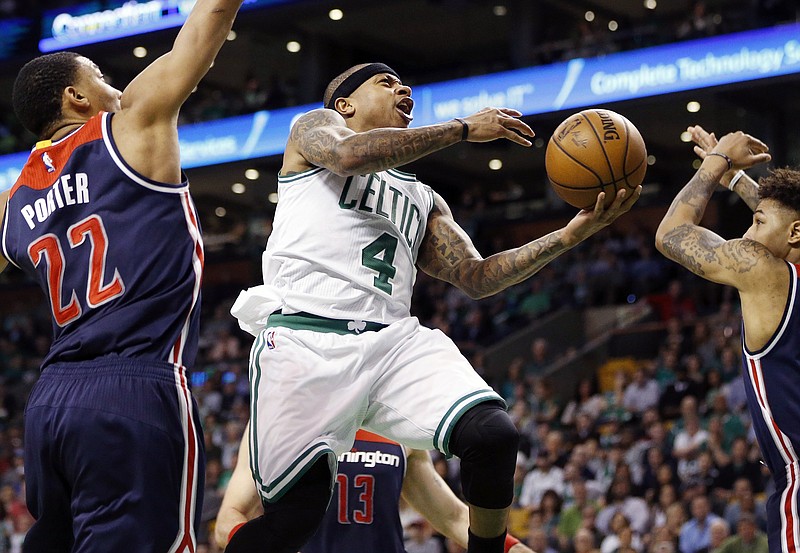 
              Boston Celtics' Isaiah Thomas (4) goes up to shoot against Washington Wizards' Otto Porter Jr. (22) during the second quarter of a second-round NBA playoff series basketball game, Sunday, April, 30, 2017, in Boston. (AP Photo/Michael Dwyer)
            
