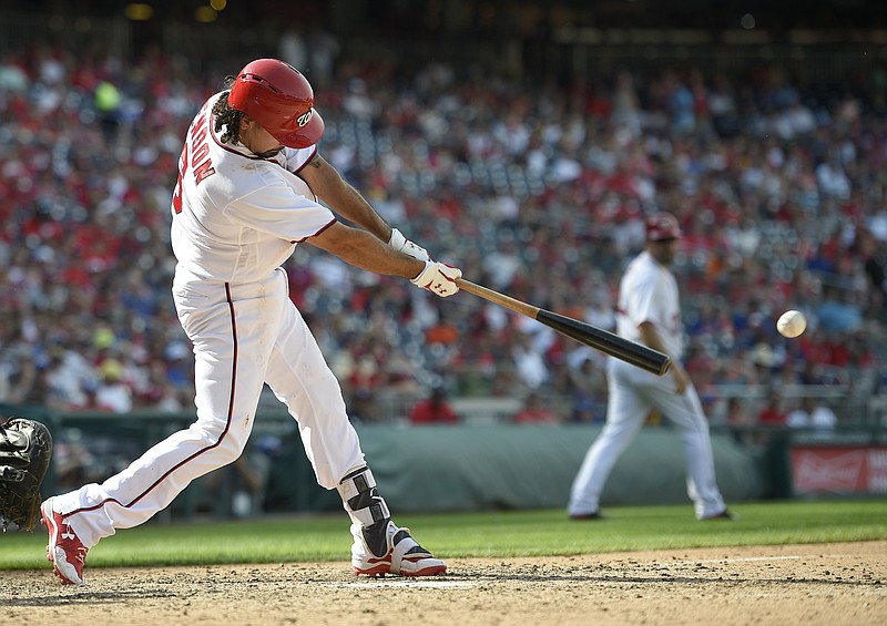 
              Washington Nationals' Anthony Rendon singles during the seventh inning of a baseball game against the New York Mets, Sunday, April 30, 2017, in Washington. (AP Photo/Nick Wass)
            