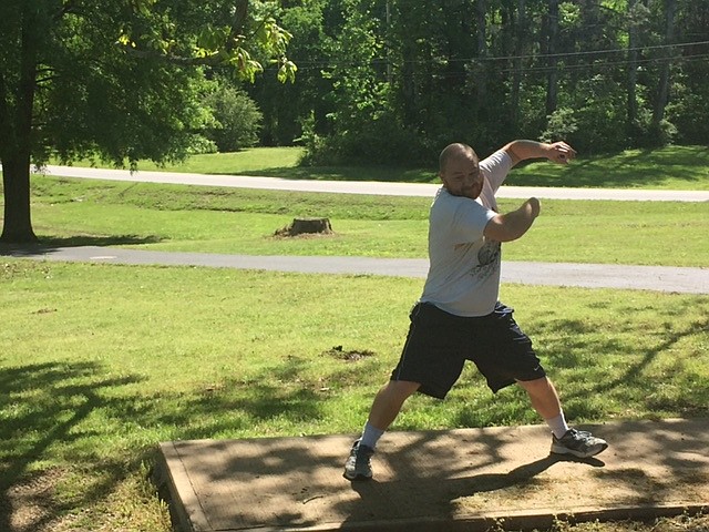 Players toss a Frisbee at Jack Mattox Recreation Complex's disc golf course on April 25. Catoosa County is hosting its first Frisbee golf tournament there Saturday, May 6. (Contributed photo by Travis Barbee)