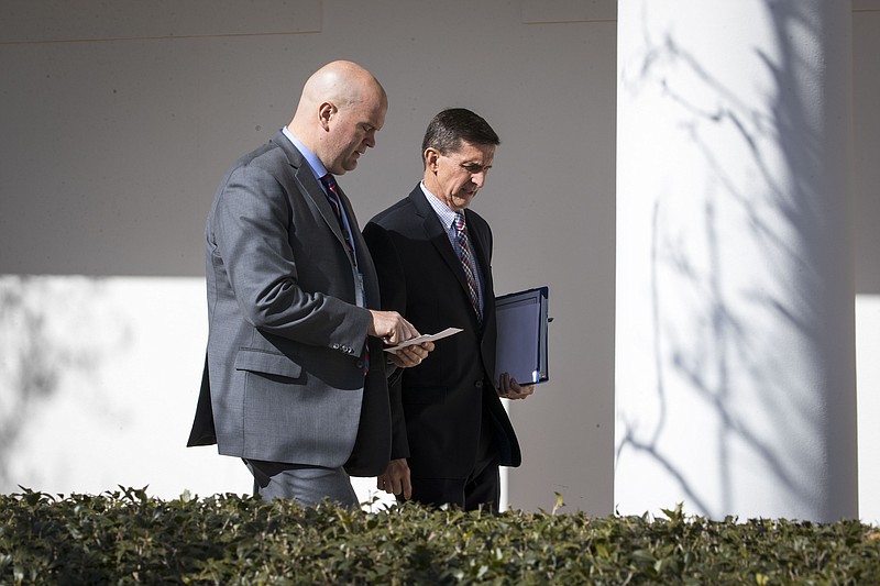 Michael Flynn, Donald Trump's national security adviser, with an aide as he walks from the West Wing of the White House in Washington in February. Flynn is under investigation by the Defense Department's inspector general to determine whether he failed to get permission to receive payment from a foreign government, according to a letter released on April 27, 2017, by the top Democrat on the House Oversight Committee.