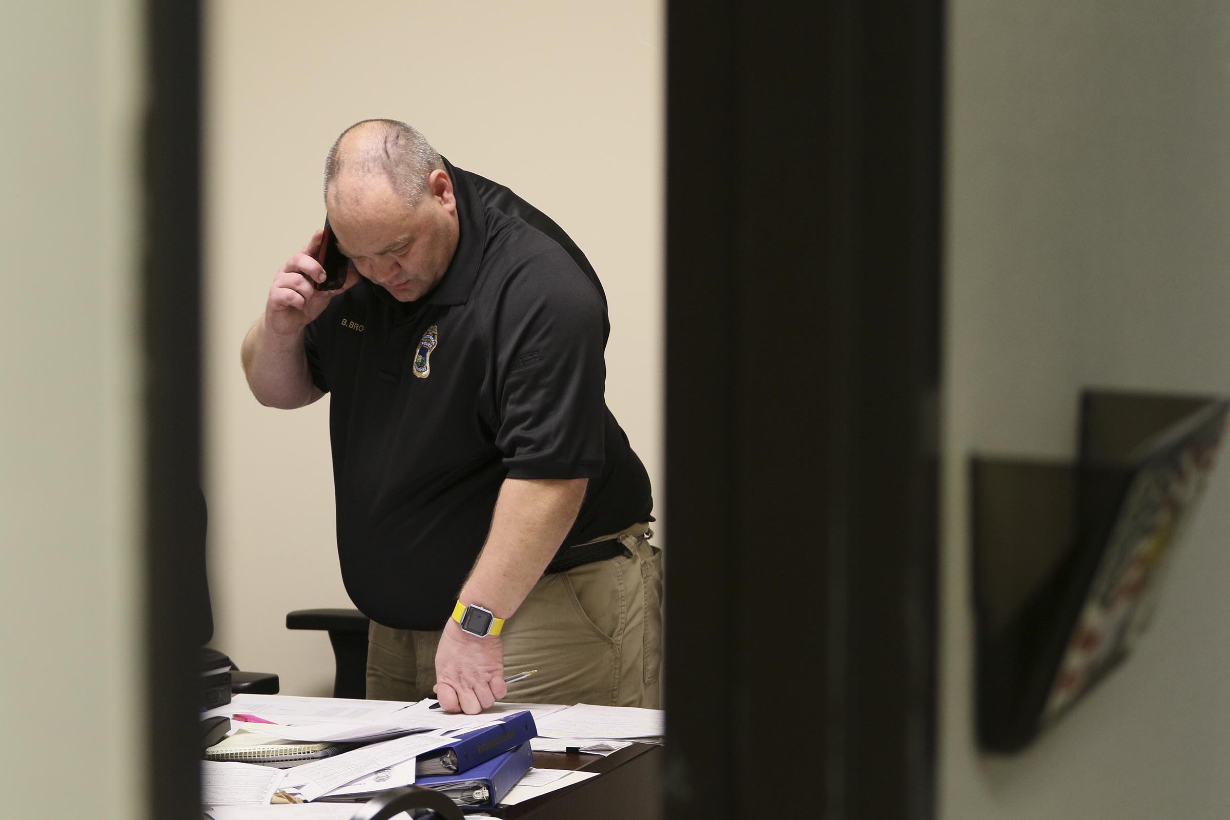 Staff Photo by Dan Henry / The Chattanooga Times Free Press- 4/27/17. Detective Brad Brown works on sorting evidence that was found in recent car and storage unit break ins while in his office at the CPD on Thursday, April 27, 2017.