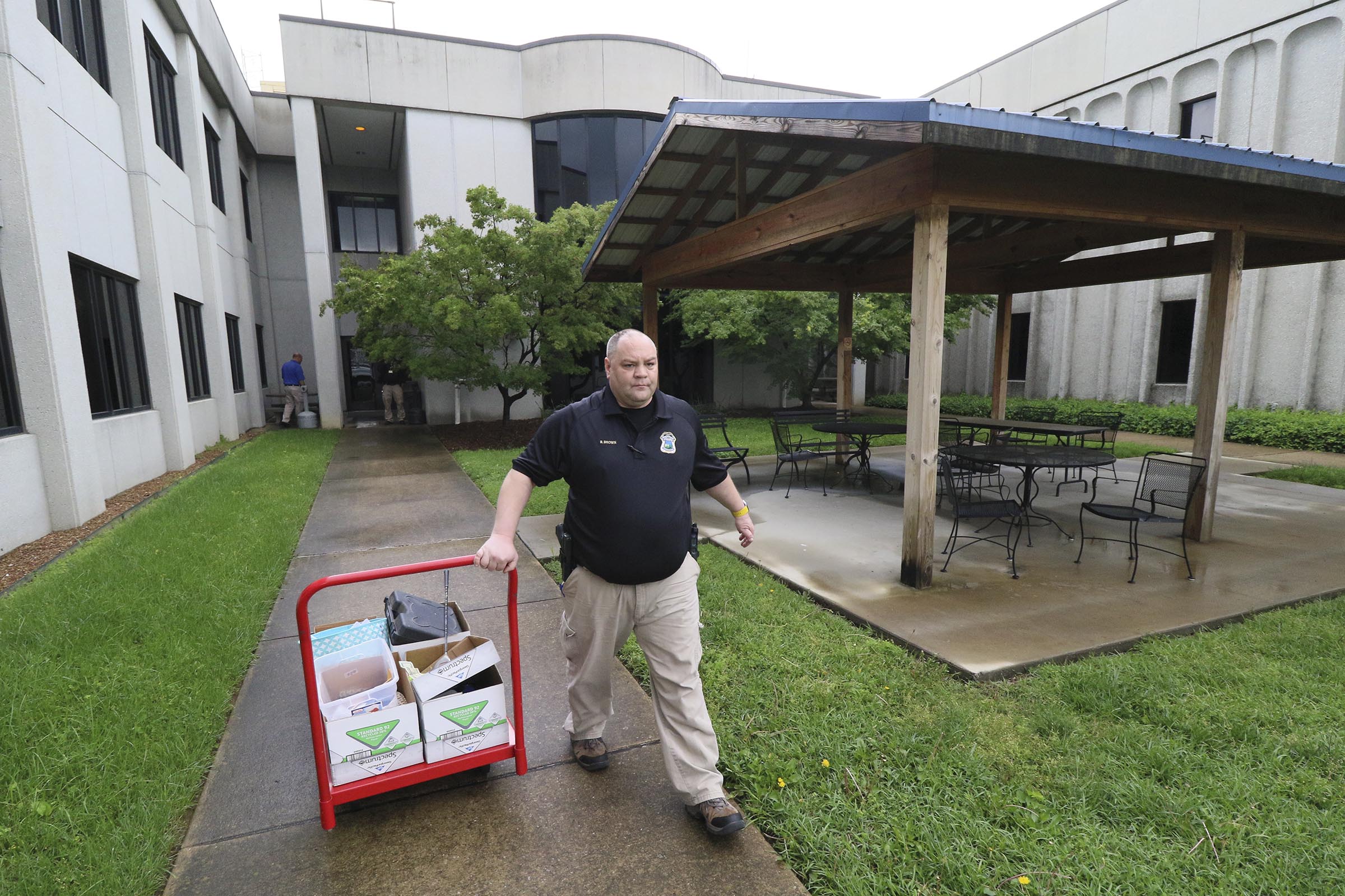 Staff Photo by Dan Henry / The Chattanooga Times Free Press- 4/27/17. Detective Brad Brown brings property that was found in recent car and storage unit break ins to the evidence room while at the CPD on Thursday, April 27, 2017.