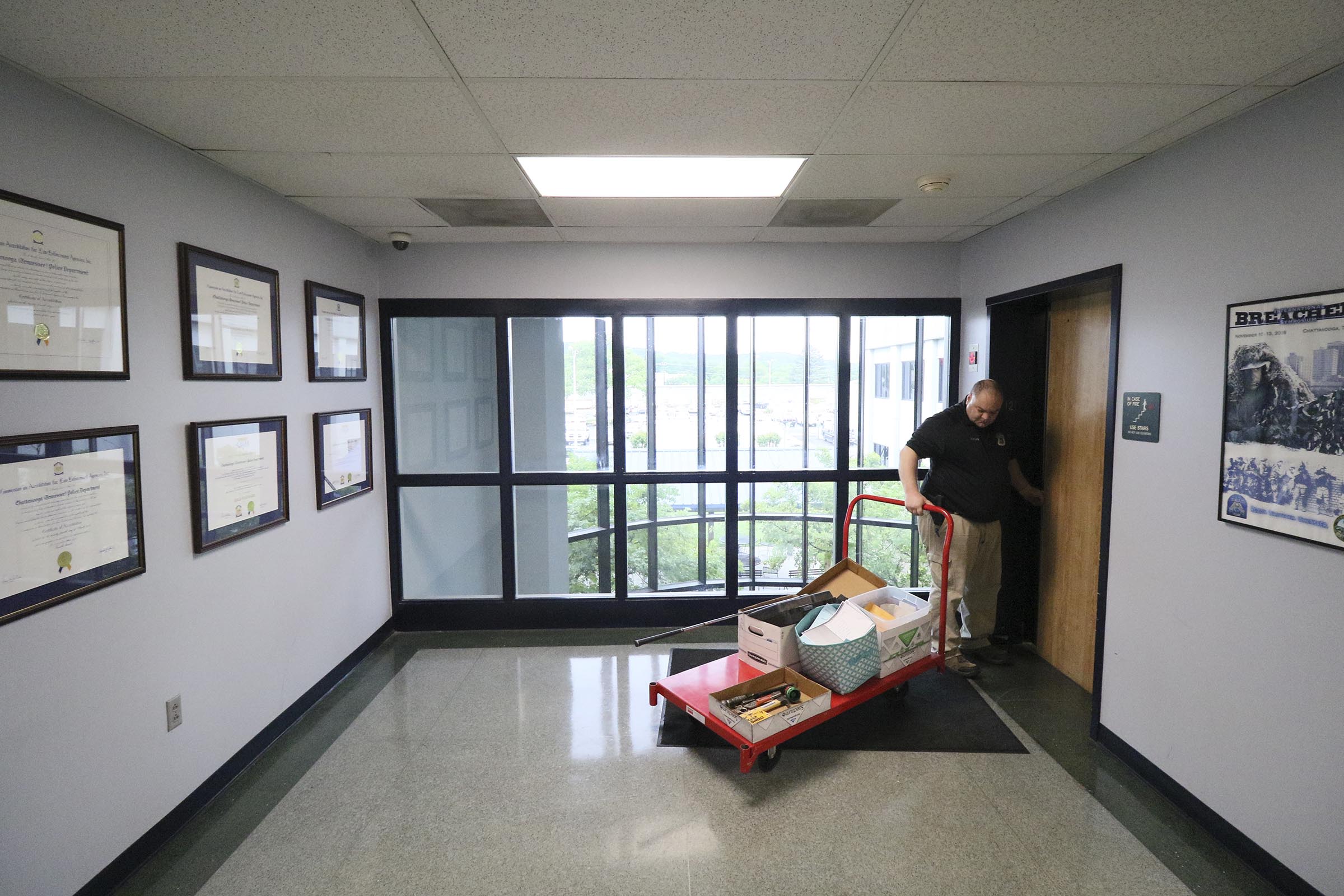 Staff Photo by Dan Henry / The Chattanooga Times Free Press- 4/27/17. Detective Brad Brown brings property that was found in recent car and storage unit break ins to the evidence room while at the CPD on Thursday, April 27, 2017.