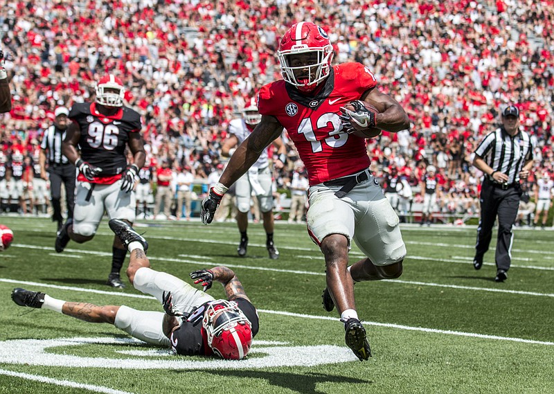 Georgia sophomore running back Elijah Holyfield, who had 15 carries for 41 yards and this 3-yard touchdown in last month's G-Day spring game, was arrested Monday on drug-related charges.