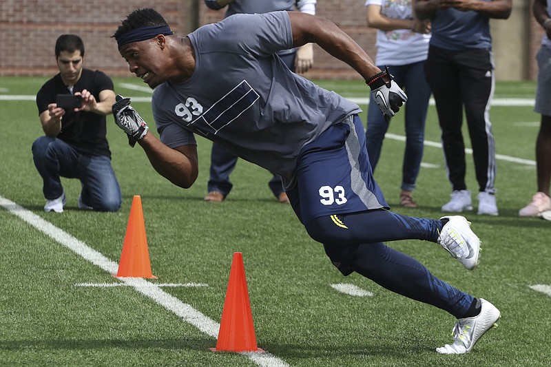 Staff Photo by Dan Henry / The Chattanooga Times Free Press- 3/30/17. Keionta Davis, 93, and other University of Tennessee at Chattanooga seniors run drills for NFL scouts at Finley Stadium on Thursday, March 30, 2017.