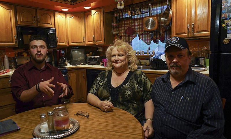 
              Daniel J. Moore, from left, Lisa Moore and Daniel E. Moore pose for a picture at their kitchen table in Newton Falls, Ohio, Monday, May 1, 2017. Facebook founder Mark Zuckerberg dined with the Moore family on Friday as part of a mission to visit all 50 states. (AP photo/Dake Kang)
            