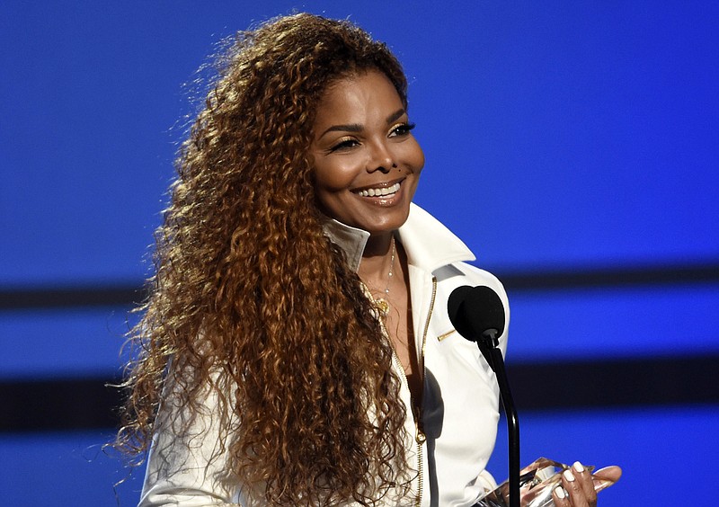 
              FILE - In this June 28, 2015, file photo, Janet Jackson accepts the ultimate icon: music dance visual award at the BET Awards in Los Angeles. In a video posted on her Twitter account May 1, 2017, Jackson confirmed a rumored split with her husband and says plans to resume the world tour she called off more than a year ago during her pregnancy with her son, who was born in January. (Photo by Chris Pizzello/Invision/AP, File)
            