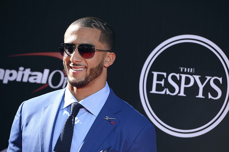 
              FILE - In this July 16, 2014, file photo, San Francisco 49ers' Colin Kaepernick arrives at the ESPY Awards at the Nokia Theatre in Los Angeles. Video and pictures from social media posted on May 1, 2017, show Kaepernick standing outside a New York City parole office with two boxes of custom-made suits. An Instagram post by Kaepernick’s “Know Your Rights Camp” campaign says the suits will make parolees “better equipped to achieve gainful employment” and “live more productive lives.” (Photo by Jordan Strauss/Invision/AP, File )
            