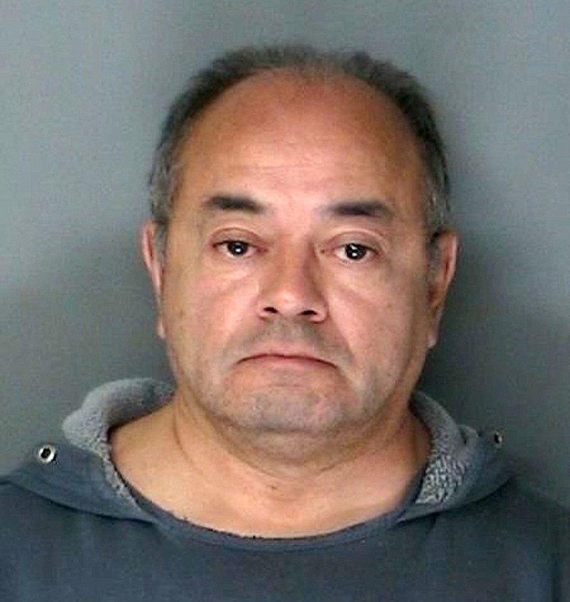 
              FILE - This undated file photo provided by the Suffolk County District Attorney's office in Riverhead, N.Y., shows foster parent Cesar Gonzales-Mugaburu. An attorney for the foster parent accused of sexually abusing his foster sons over two decades said Friday, April 21, 2017, that no forensic, medical or physical evidence suggests his client committed the abuse.(Suffolk County District Attorney's Office via AP, File)
            