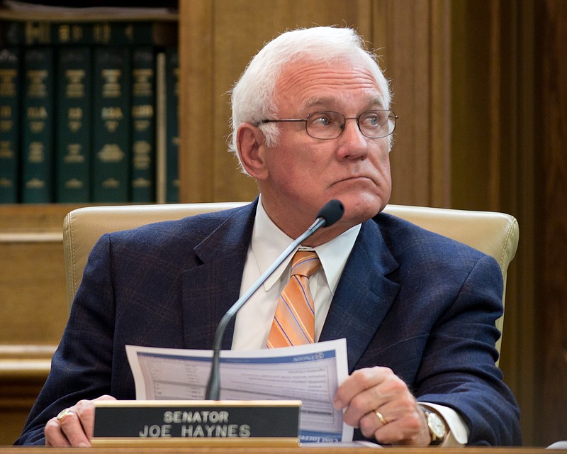 In this Tuesday, Jan. 31, 2012, file photo, Democratic Sen. Joe Haynes of Goodlettsville, Tenn., listens to a presentation in the Senate Finance Committee in Nashville.