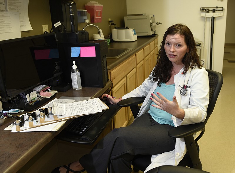 Dr. Danielle Mitchell is photographed in her North Access Road office at the Chattanooga Sports Institute Center for Health on Thursday, Aug. 20, 2015, in Chattanooga, Tenn. A critic of insurance companies, she has set up a membership model for patients.