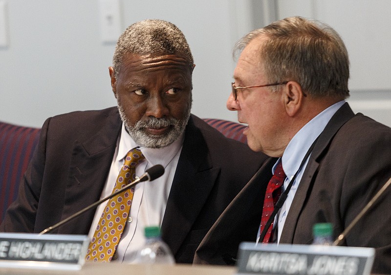 Hamilton County Board of Education Chairman Steve Highlander, right, confers with interim Superintendent Dr. Kirk Kelly at a recent school board meeting.