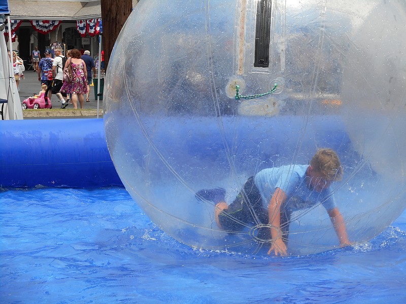 Hannah Newman captured this image of a boy at play in a bubble ball during Fourth of July festivities. below.