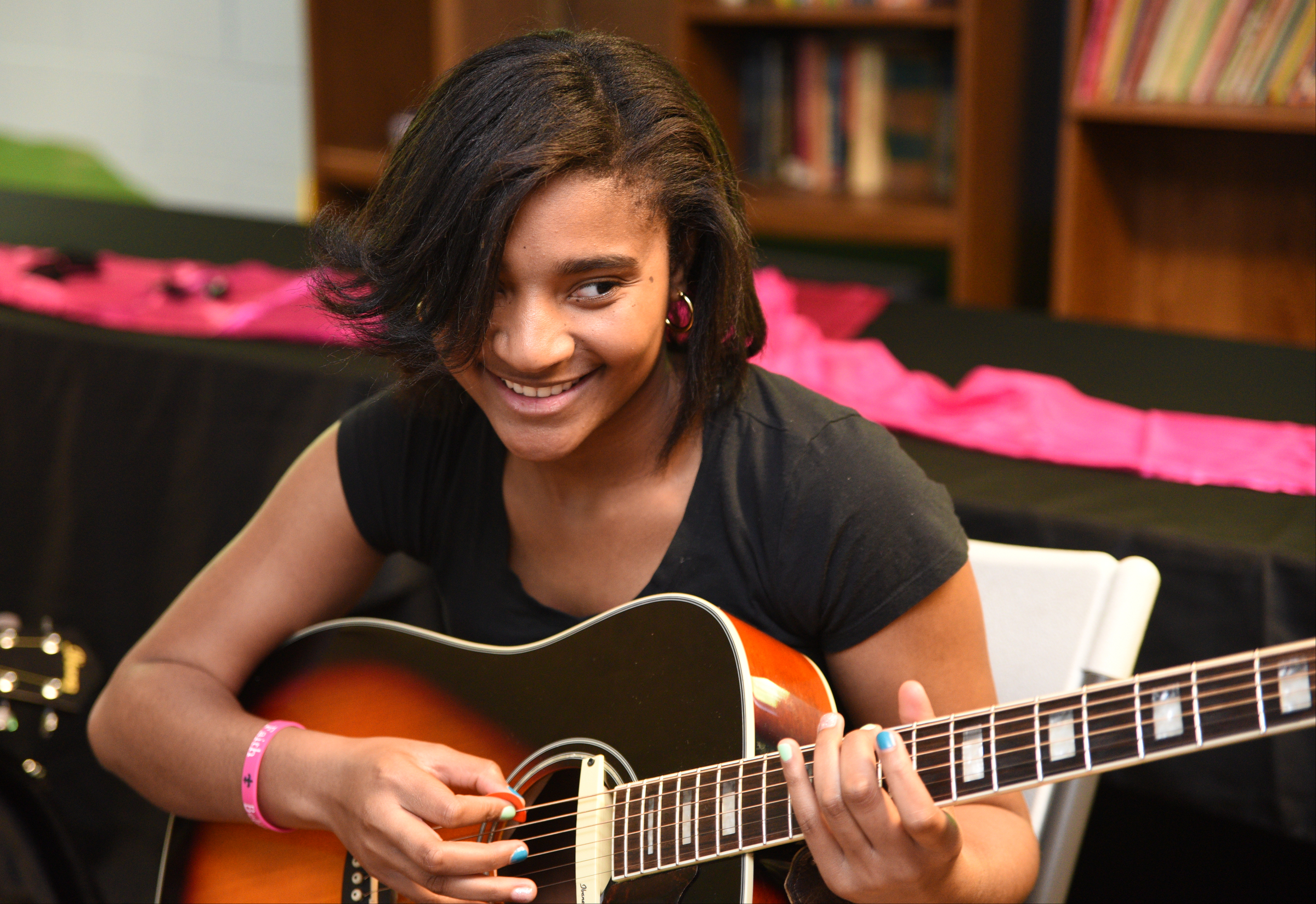 Taylor Slack plays guitar Wednesday, April 26, 2017 at Temple of Faith Deliverance Church.