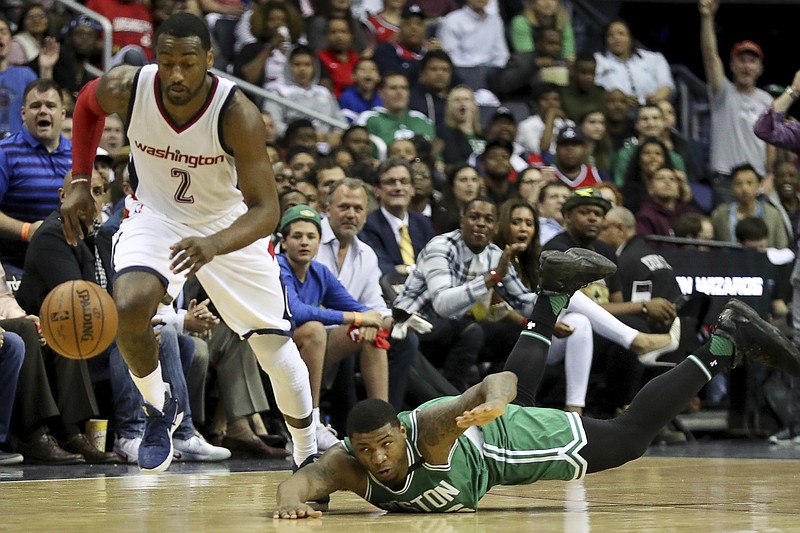 
              Boston Celtics guard Marcus Smart (36) dives after a ball stollen by Washington Wizards guard John Wall (2) during the first half in Game 3 of a second-round NBA playoff series basketball game, Thursday, May 4, 2017, in Washington. (AP Photo/Andrew Harnik)
            
