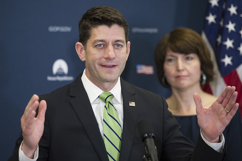 In this May 2, 2017, photo, House Speaker Paul Ryan of Wis., accompanied by Rep. Cathy McMorris Rodgers, R-Wash., speaks to reporters on Capitol Hill in Washington. A government-wide spending bill that President Donald Trump seemed to criticize Tuesday morning but now calls "a clear win for the American people" is headed for a House vote on Wednesday. (AP Photo/Cliff Owen)