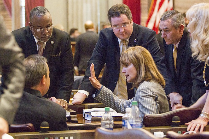 House Speaker Beth Harwell, R-Nashville, speaks to colleagues amid an impasse about the state budget bill on the House floor on Thursday, May 4, 2017. From left are Reps. Judd Matheny, R-Tullahoma; Antonio Parkinson, D-Memphis; Matthew Hill, R-Jonesborough; Glen Casada, R-Franklin; and Sherry Jones, D-Nashville. (AP Photo/Erik Schelzig)