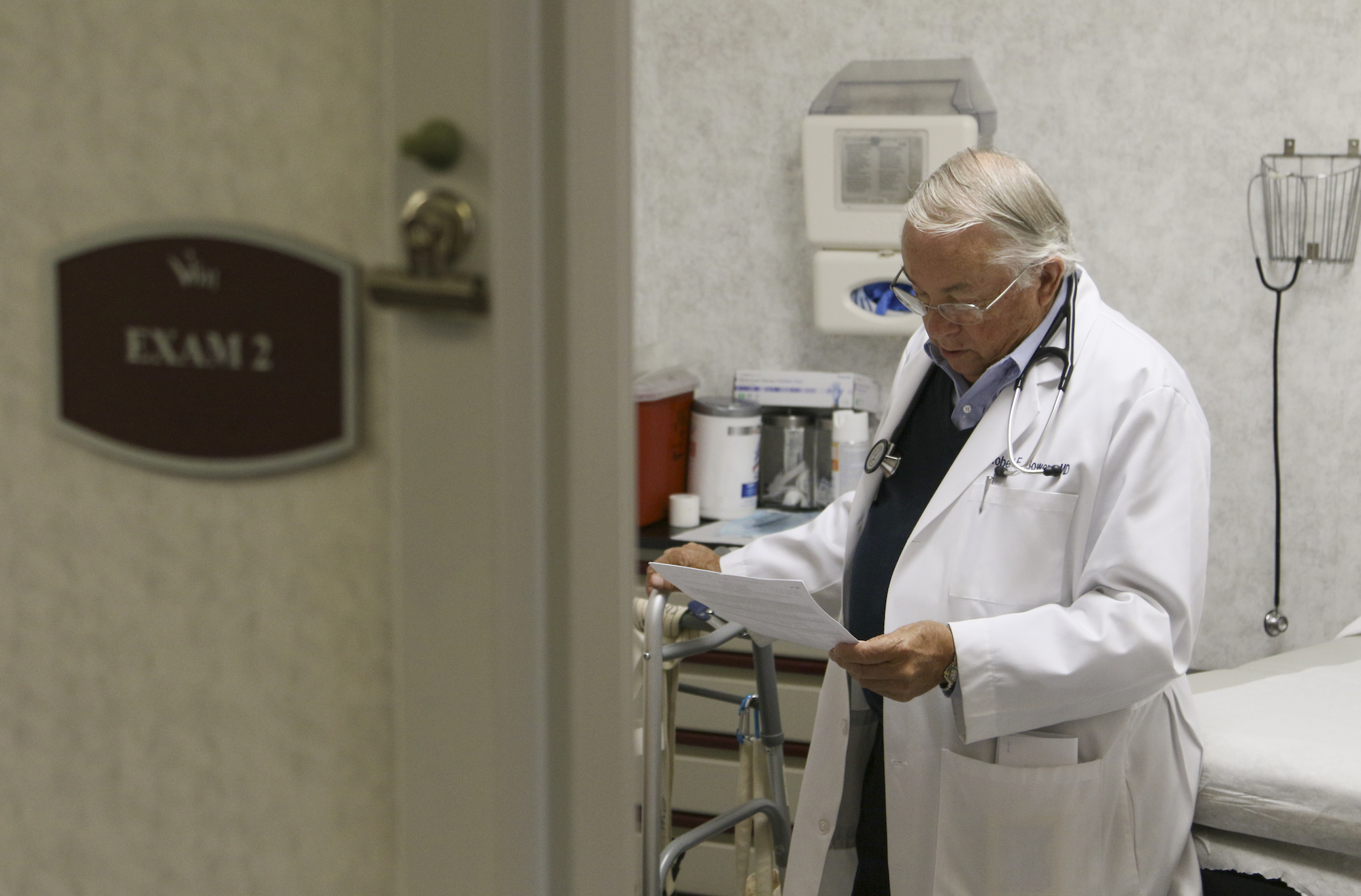 Dr. Robert Bowers visits a patient at Volunteers In Medicine.