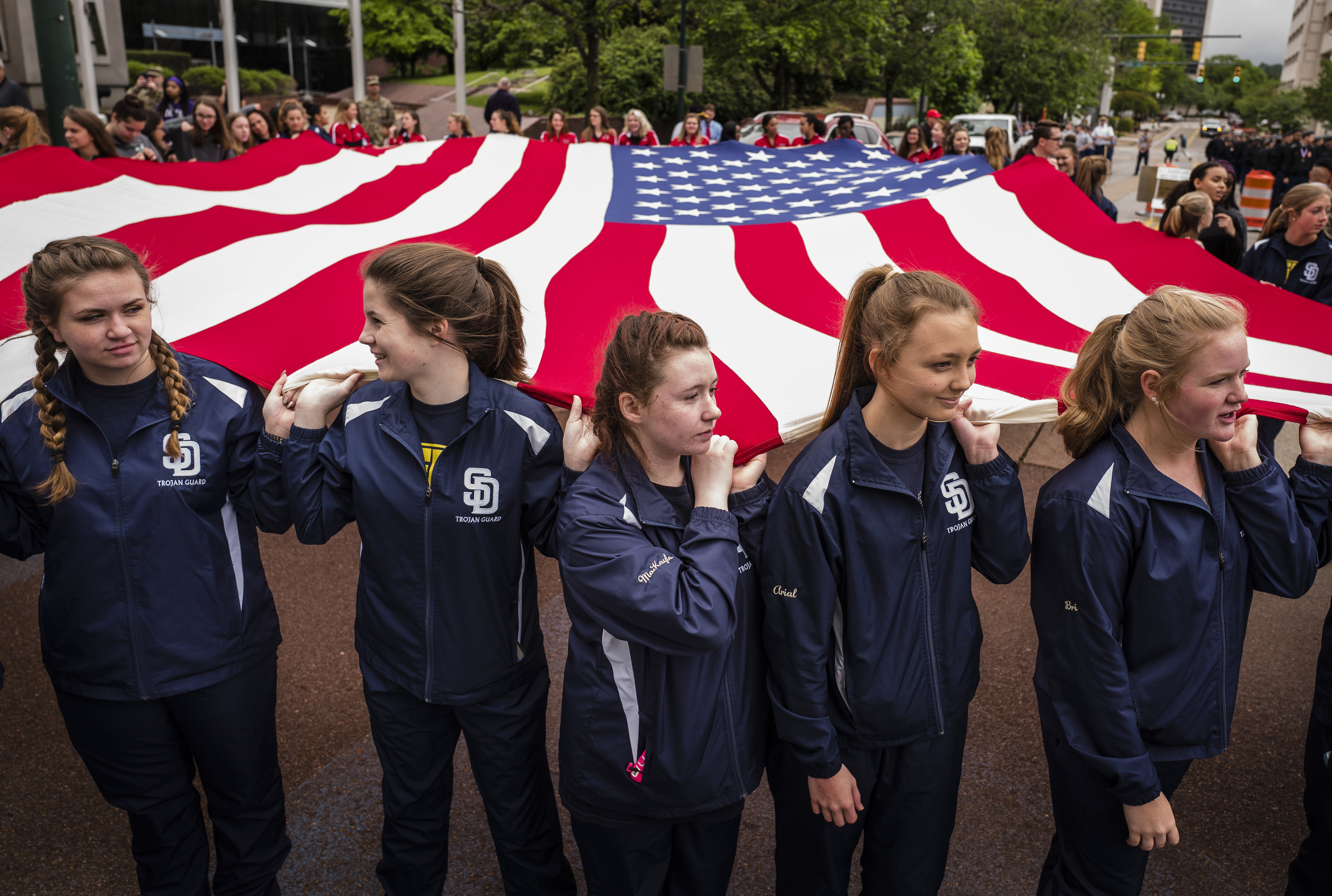 Soddy-Daisy High School students hold a giant American flag as they wait for the start of the annual Armed Forces Day Parade on Market Street on Friday, May 5, 2017, in Chattanooga, Tenn. This year's parade highlighted the United States Air Force.