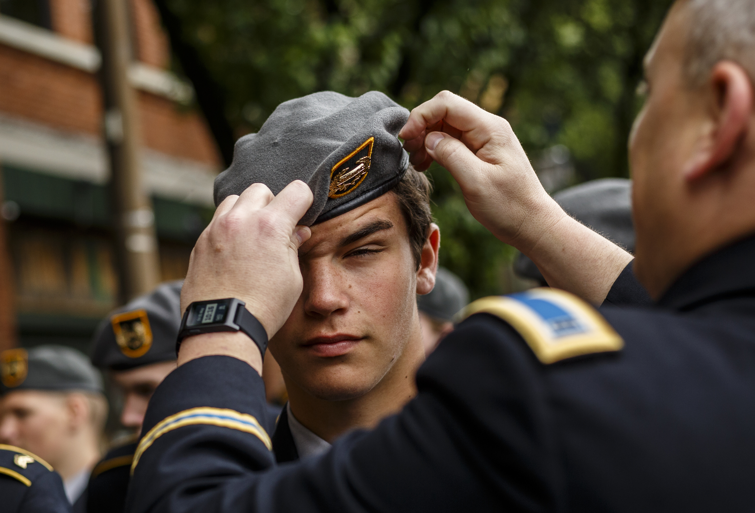 Chief Jim Holovacko straights Soddy Daisy High School JROTC Cadet Sgt. Zach Schafer's hat as they line up before the annual Armed Forces Day Parade on Market Street on Friday, May 5, 2017, in Chattanooga, Tenn. This year's parade highlighted the United States Air Force.