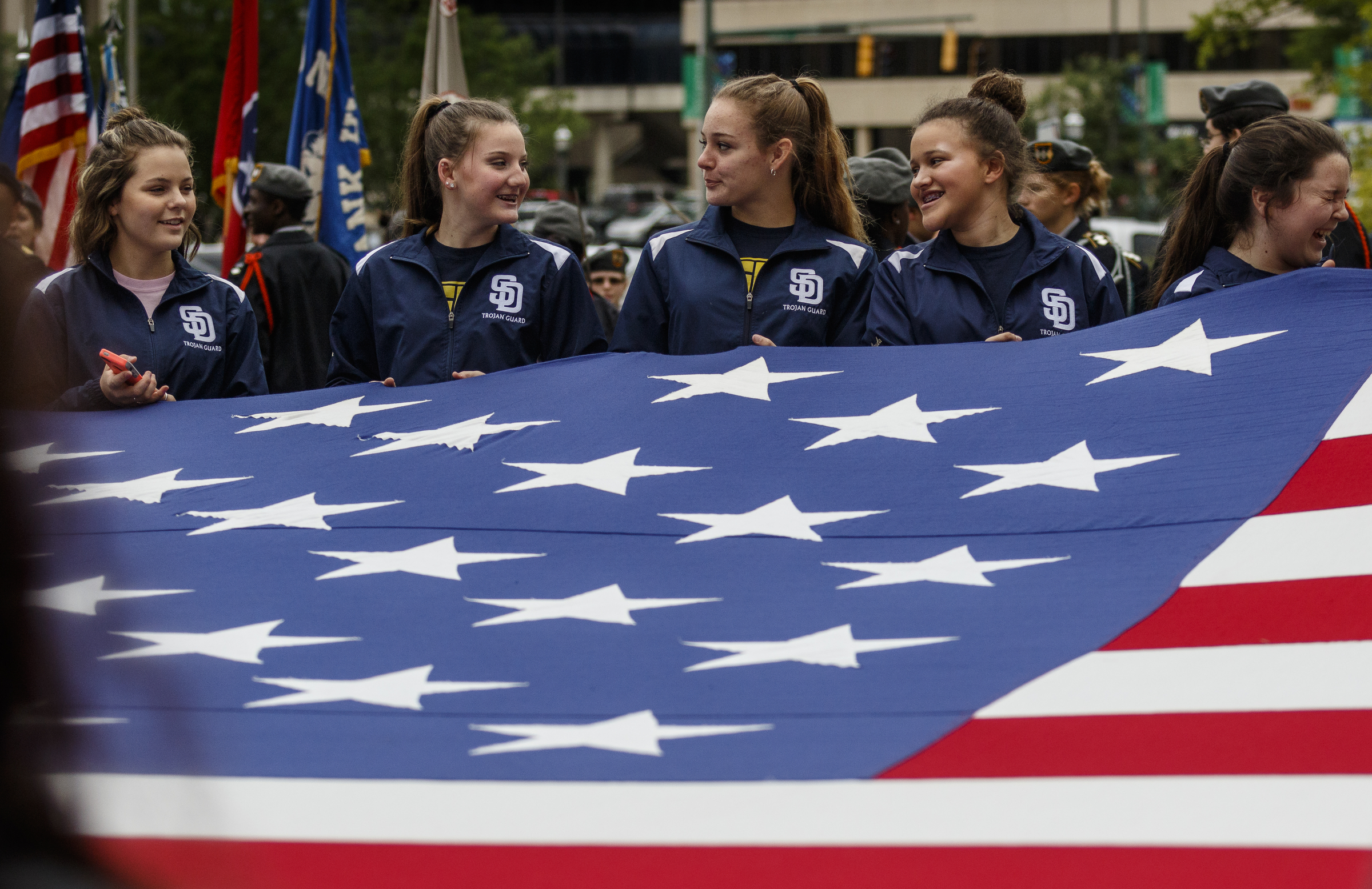 Soddy-Daisy High School students hold a giant American flag as they wait for the start of the annual Armed Forces Day Parade on Market Street on Friday, May 5, 2017, in Chattanooga, Tenn. This year's parade highlighted the United States Air Force.