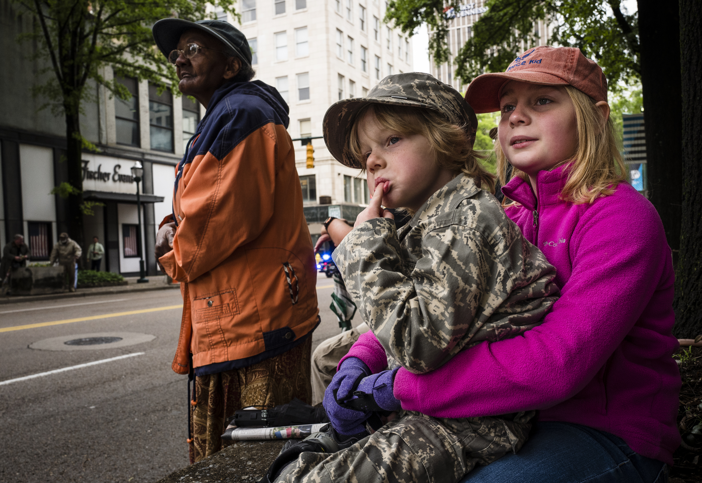 Makaela Chance, right, holds her brother Bradley as they wait for their father Tech Sgt. Robert Chance to pass with the Air Force Band during the annual Armed Forces Day Parade on Market Street on Friday, May 5, 2017, in Chattanooga, Tenn. This year's parade highlighted the United States Air Force.