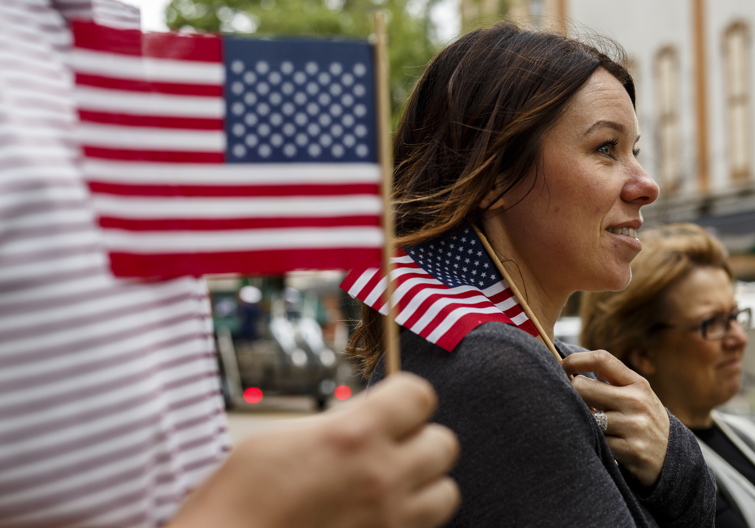 Brandy Fitzsimmons holds an American flag as she watches the annual Armed Forces Day Parade on Market Street on Friday, May 5, 2017, in Chattanooga, Tenn. This year's parade highlighted the United States Air Force.