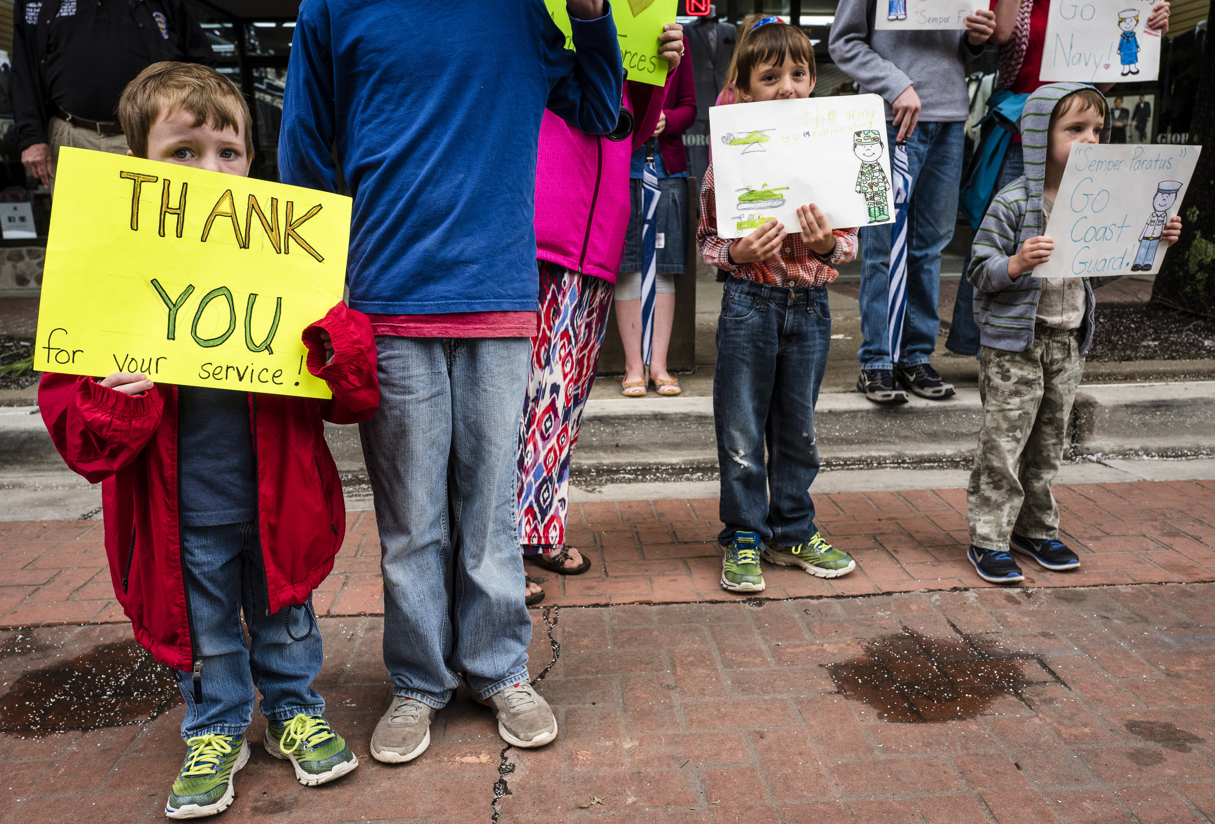 Asher Pyles, left, Samuel Pyles, center, and Daniel Pyles watch the annual Armed Forces Day Parade on Market Street on Friday, May 5, 2017, in Chattanooga, Tenn. This year's parade highlighted the United States Air Force.