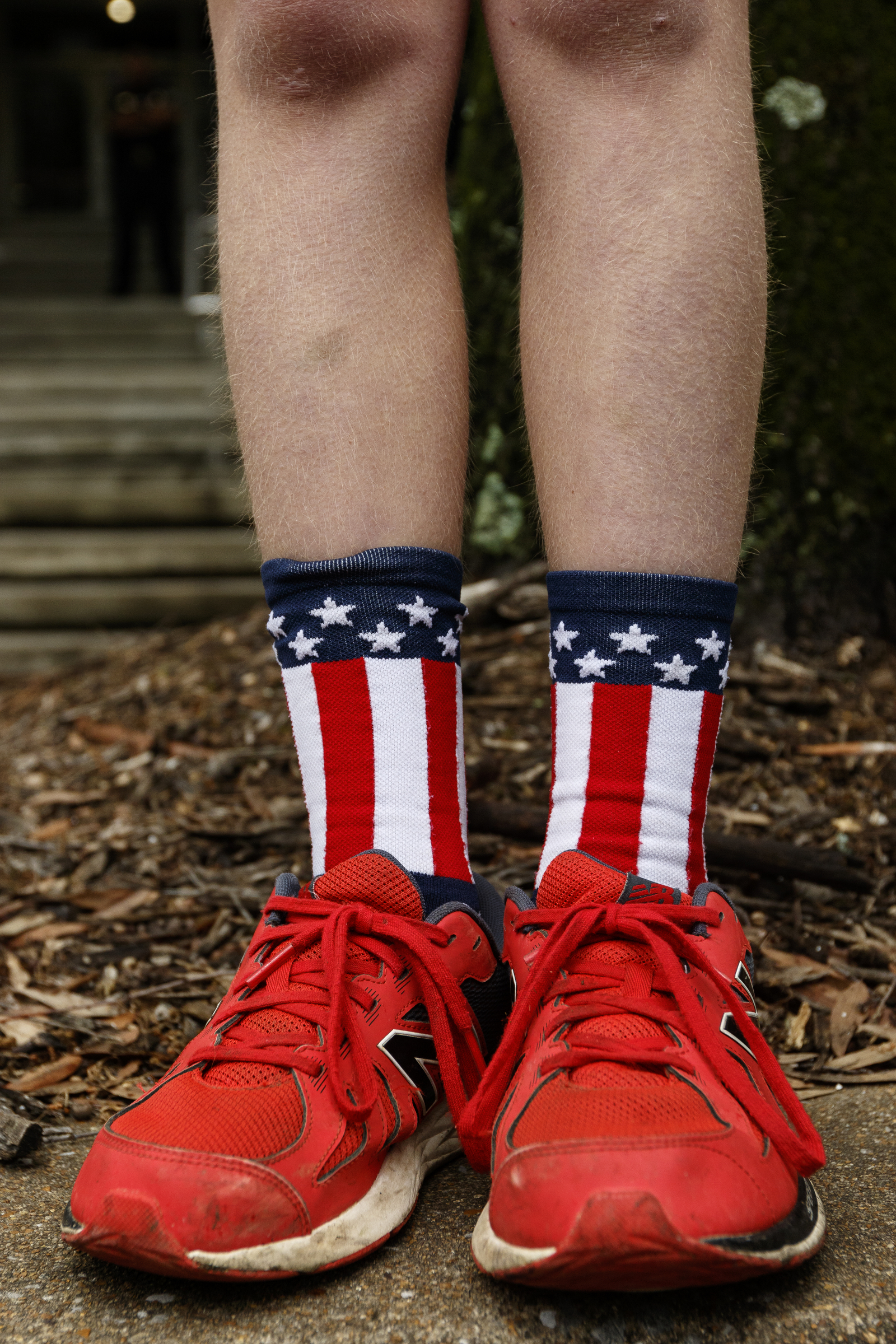 Corey Waters wears flag socks as he watches the annual Armed Forces Day Parade on Market Street on Friday, May 5, 2017, in Chattanooga, Tenn. This year's parade highlighted the United States Air Force.