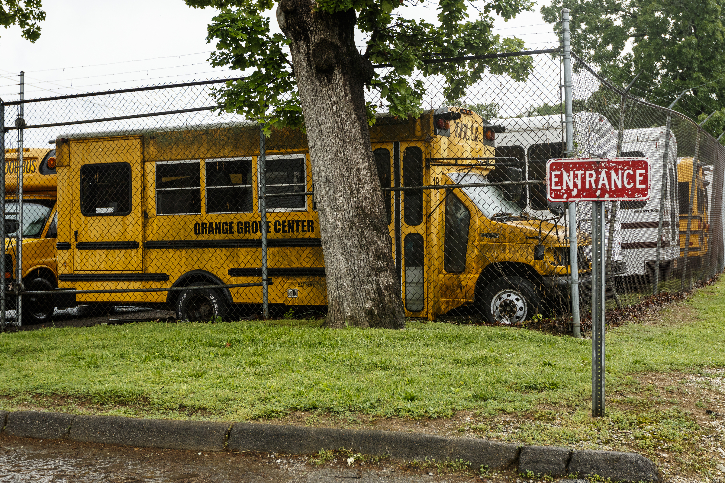 A school bus is parked in the Orange Grove Center bus lot on Thursday, May 4, 2017, in Chattanooga, Tenn. The center has had numerous complaints about patient care, and a client was found dead on a different Orange Grove bus last month.