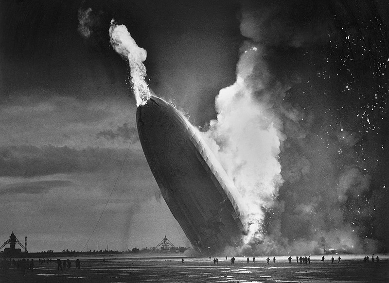 In this May 6, 1937 file photo, the German dirigible Hindenburg crashes to earth in flames after exploding at the U.S. Naval Station in Lakehurst, N.J. Only one person is left of the 62 passengers and crew who survived when the Hindenburg burst into flames 80 years ago Saturday, May 6, 2017. Werner Doehner was 8 years old when he boarded the zeppelin with his parents and older siblings after their vacation to Germany in 1937. The 88-year-old now living in Parachute, Colo., tells The Associated Press that the airship pitched as it tried to land in New Jersey and that "suddenly the air was on fire." (AP Photo/Murray Becker, File)